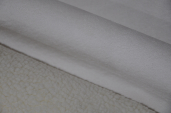 Warp knitted and polar fleece composite fabric