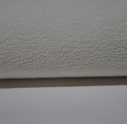 Warp knitted and polar fleece composite fabric